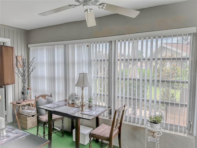 sunroom / solarium featuring ceiling fan