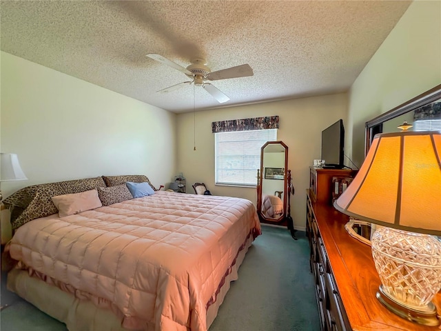 bedroom with ceiling fan, a textured ceiling, and dark colored carpet