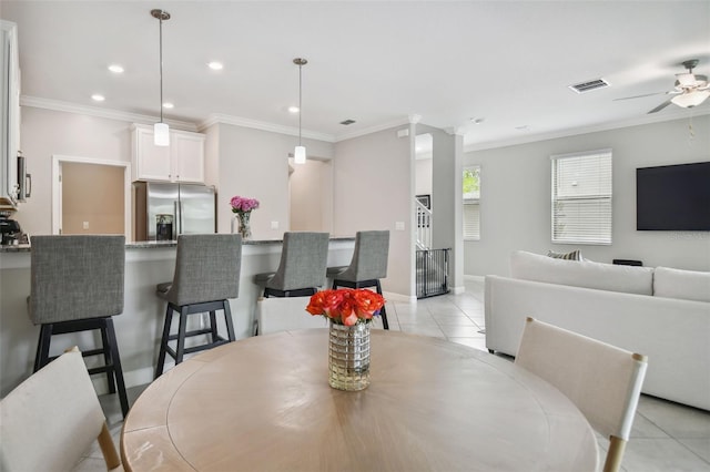 dining room with recessed lighting, visible vents, crown molding, and light tile patterned floors