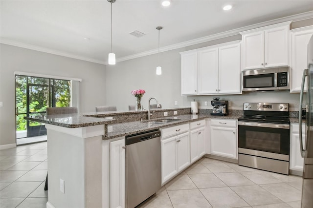 kitchen featuring white cabinets, stainless steel appliances, and a sink