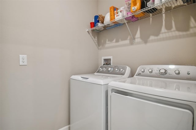 clothes washing area with laundry area and washer and clothes dryer