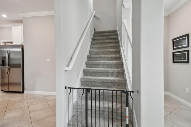 staircase featuring ornamental molding, recessed lighting, tile patterned flooring, and baseboards