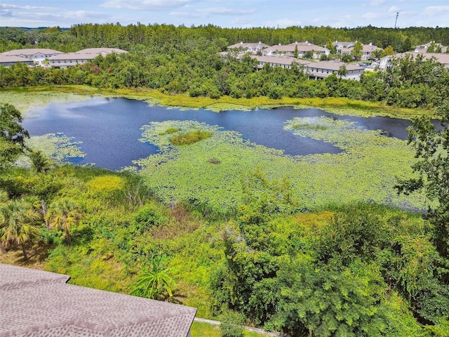 birds eye view of property featuring a water view and a residential view