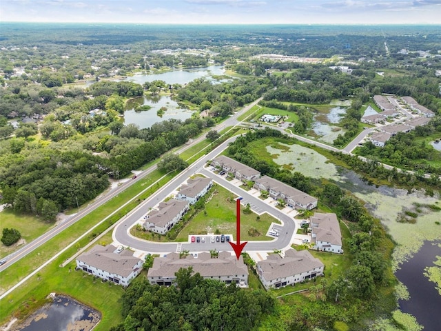 birds eye view of property with a residential view and a water view