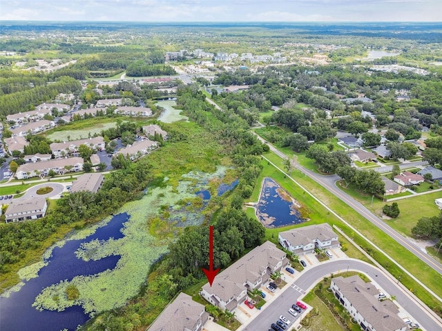 birds eye view of property with a residential view and a water view