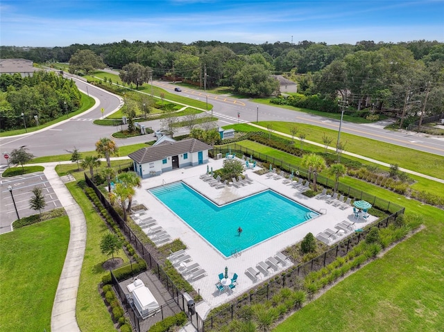 view of swimming pool with fence