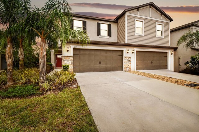 view of front of property with a garage