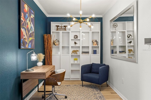 office area with a notable chandelier, crown molding, and light wood-type flooring