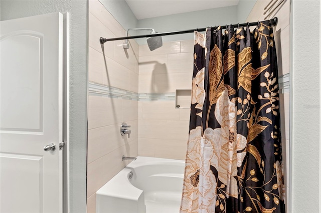 bathroom featuring shower / tub combo with curtain