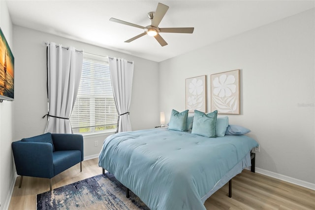 bedroom featuring light hardwood / wood-style flooring and ceiling fan