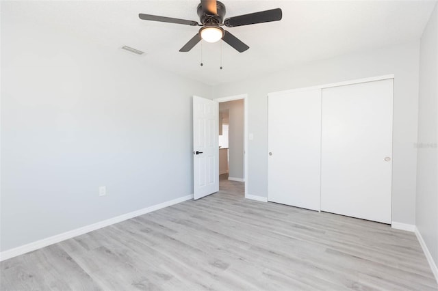 unfurnished bedroom featuring a closet, ceiling fan, and light hardwood / wood-style floors