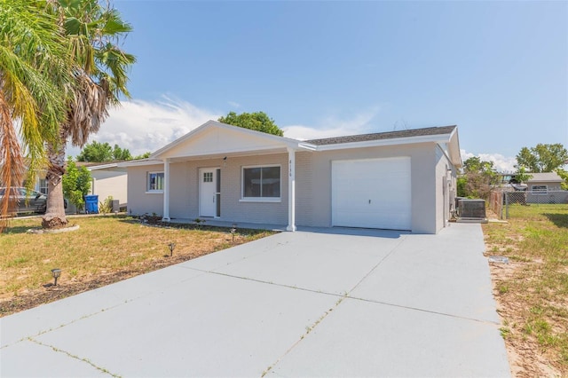 ranch-style home with a front yard and a garage