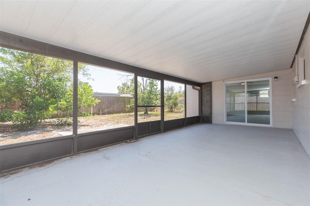 unfurnished sunroom with vaulted ceiling