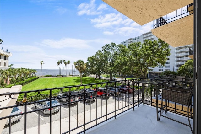 balcony featuring a water view