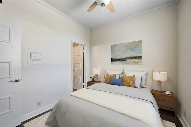 bedroom featuring ceiling fan, hardwood / wood-style flooring, and crown molding