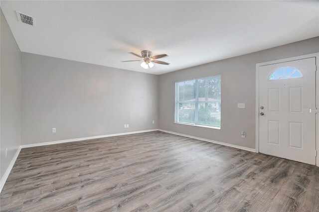 foyer entrance featuring ceiling fan and hardwood / wood-style floors