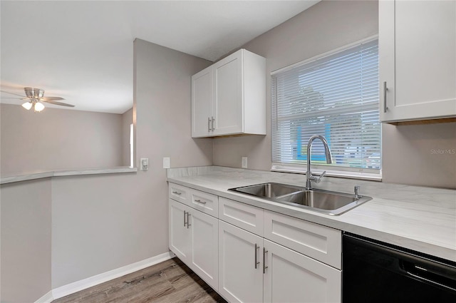 kitchen with ceiling fan, hardwood / wood-style flooring, white cabinets, dishwasher, and sink