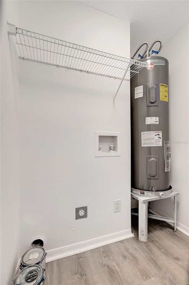 utility room featuring water heater