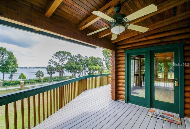 wooden terrace featuring a ceiling fan, french doors, and a water view