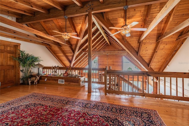 interior space featuring hardwood / wood-style flooring, ceiling fan, and visible vents