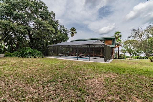 view of yard with a lanai and an outdoor pool