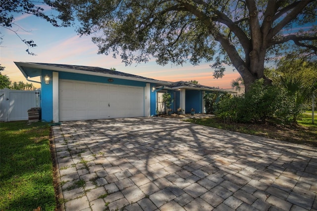 ranch-style home featuring a garage