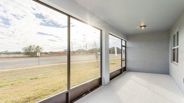 sunroom / solarium featuring a healthy amount of sunlight