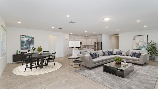 living room with light tile patterned flooring