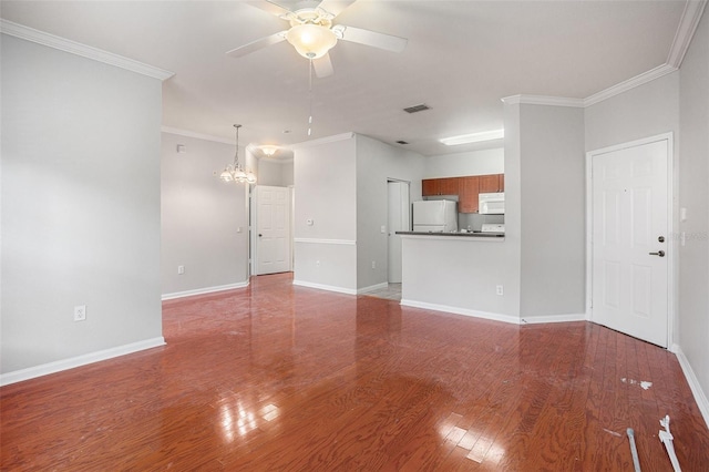 unfurnished living room featuring ceiling fan with notable chandelier, crown molding, and hardwood / wood-style floors