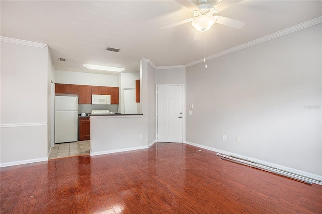 unfurnished living room with ceiling fan, ornamental molding, and light wood-type flooring