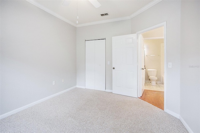 unfurnished bedroom with ceiling fan, carpet floors, and ornamental molding