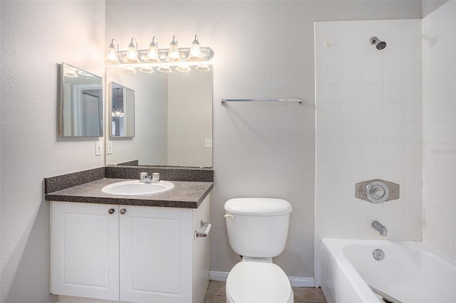 full bathroom with tile patterned flooring, tiled shower / bath, toilet, and vanity