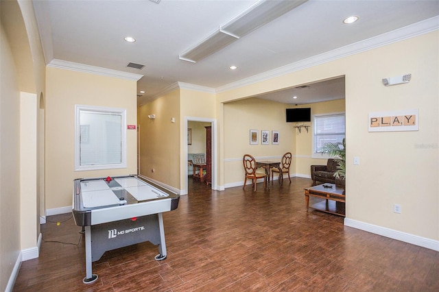 playroom featuring crown molding and dark hardwood / wood-style floors