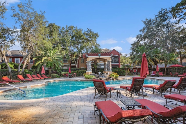 view of swimming pool featuring a patio area