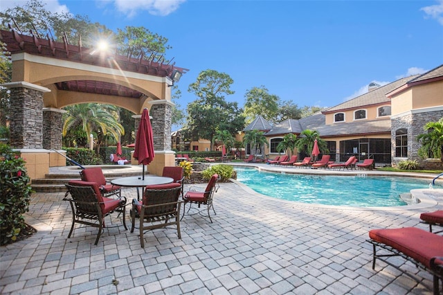 view of swimming pool with a patio