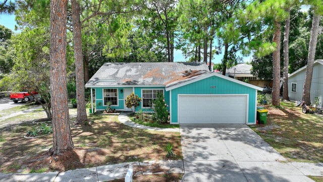 single story home with a garage