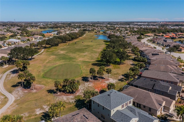 bird's eye view featuring a residential view, view of golf course, and a water view