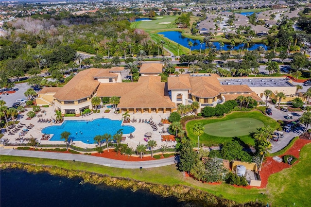 aerial view featuring a residential view, a water view, and golf course view