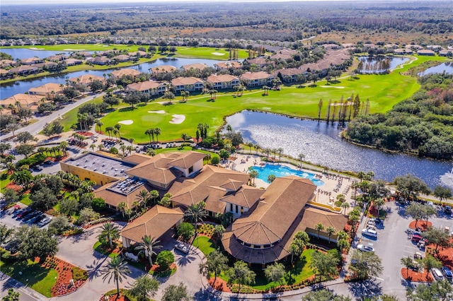 birds eye view of property with a residential view, view of golf course, and a water view