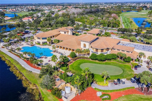drone / aerial view featuring a water view and golf course view