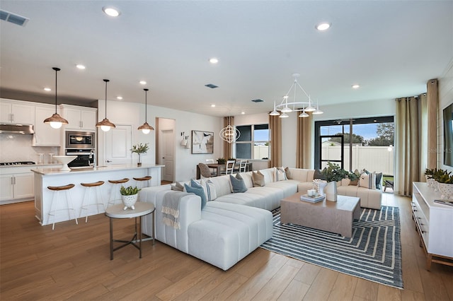 living room with light hardwood / wood-style flooring