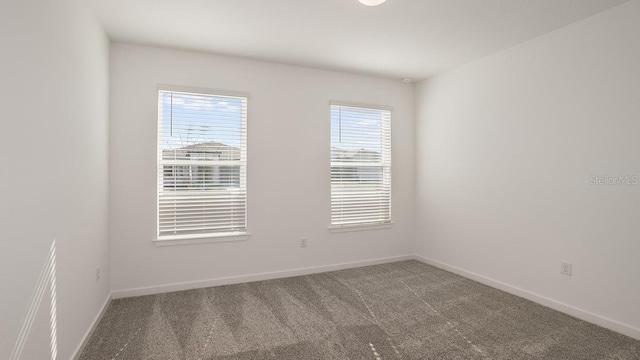 empty room featuring carpet flooring