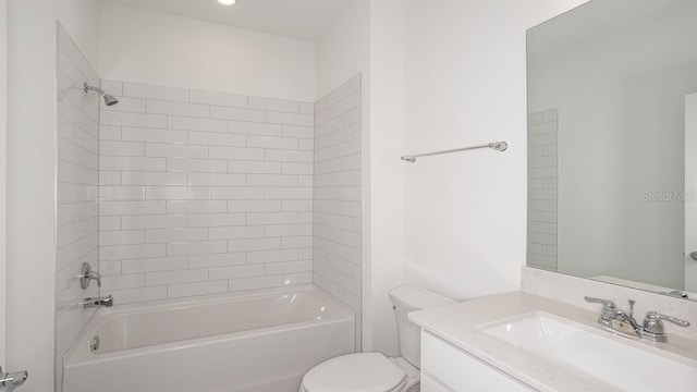 full bathroom with vanity, toilet, and tiled shower / bath