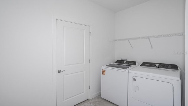 laundry room with washing machine and dryer