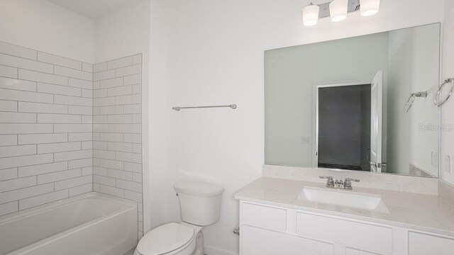 full bathroom with tiled shower / bath combo, vanity, and toilet