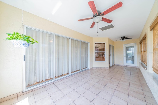 unfurnished sunroom with visible vents