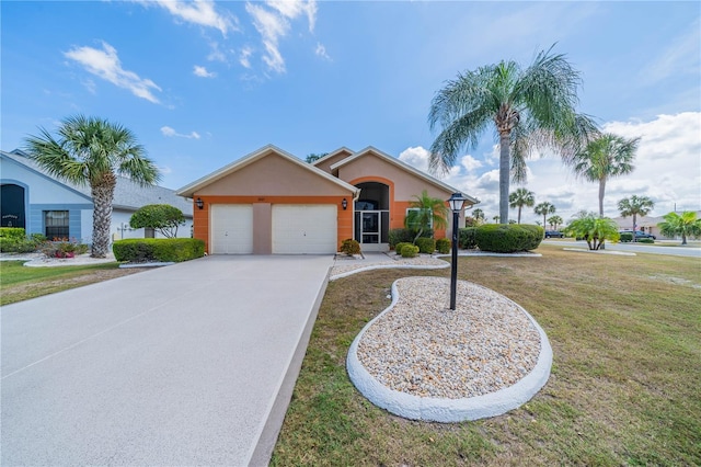 view of front of property with a front lawn, driveway, an attached garage, and stucco siding