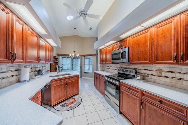 kitchen with appliances with stainless steel finishes, ceiling fan with notable chandelier, backsplash, and sink