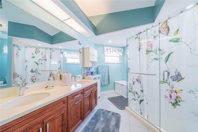 bathroom with tile patterned flooring, vanity, vaulted ceiling, and an enclosed shower