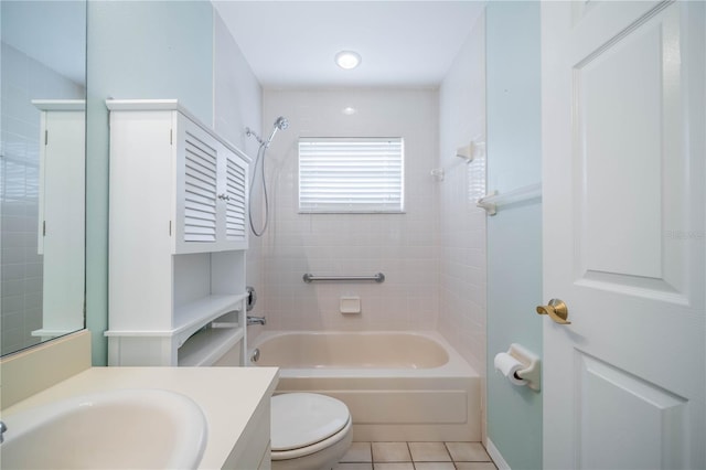 full bathroom featuring vanity, tiled shower / bath combo, toilet, and tile patterned floors